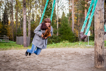 girl swinging on an old swing