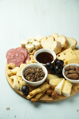 Assorted appetizers on desk. Cheeses, pate, honey, nuts
