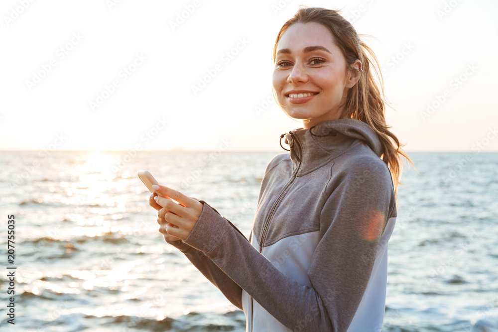 Sticker Smiling young sportswoman