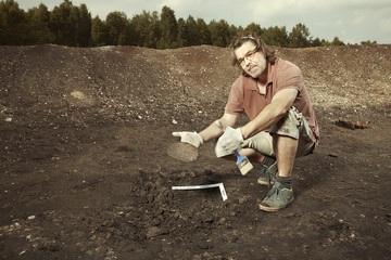 Cuneiform writing of Akkad Empire in brown clay found on summer terrain excavations
