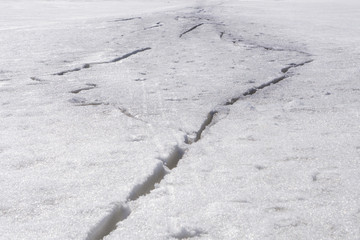 crack on the ice in the spring .