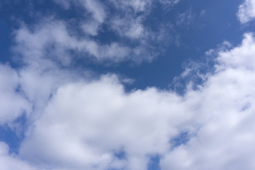 Fantastic soft white clouds against blue sky .