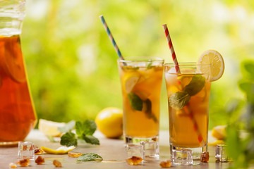 Iced tea with lemon and ice cubes