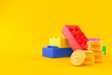 Naklejka premium Toy blocks with stack of coins