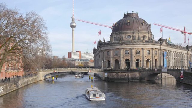 Berlin river Spree with riverbus tour and Island of museums with Bode-Museum building, TV tower