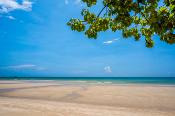 Fototapeta na wymiar Sand beach and blue sky background