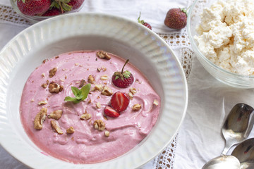 healthy curd breakfast from strawberry yogurt in a bowl