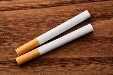 cigarettes close-up on a wooden background. Drug addiction. Smoking of tobacco. cancer. Nicotine....