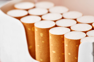 cigarettes in a pack close-up on a white background. Drug addiction. Smoking of tobacco. cancer. Nicotine. Bad habit.