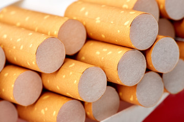 cigarettes in a pack close-up on a white background. Drug addiction. Smoking of tobacco. cancer. Nicotine. Bad habit.