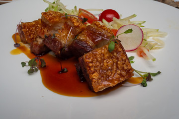 Fine food: Crispy roast pork with an apple salad cherry tomato and red radish