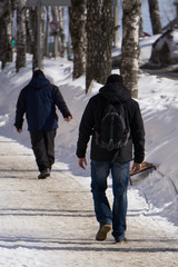 Young man with city view along the road .