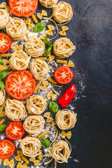 Pasta and fresh vegetables scattered in flour