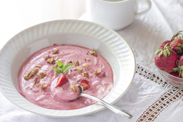 in a bowl of homemade curd strawberry yogurt