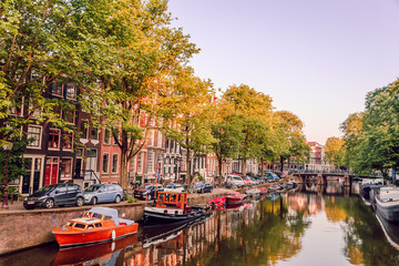 sunrise on the streets and canals of amsterdam - obrazy, fototapety, plakaty