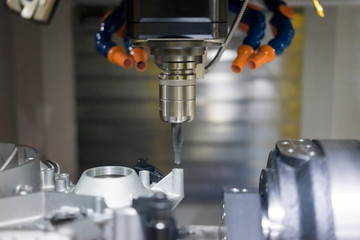 High precision CNC machining center working, operator machining automotive sample part process