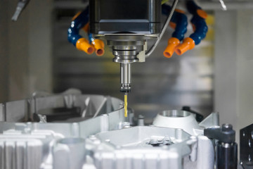 High precision CNC machining center working, operator machining automotive sample part process