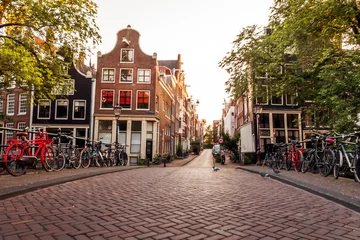 Schilderijen op glas sunrise on the streets and canals of amsterdam © MKavalenkau
