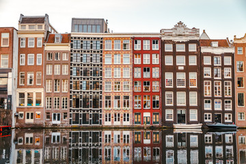 sunrise over the traditional Amsterdam houses on the Domraq canal