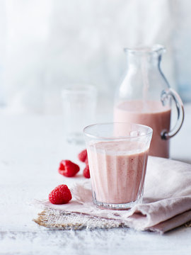 Still life of peach chia raspberry smoothie in glass