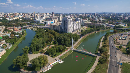 Aerial view on "the arrow" - the place of confluence Kharkiv river and Lopan river, in Ukrainian city of Kharkiv. In the foreground it is visible the boat station and the pedestrian bridge.