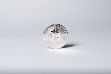 Silver bitcoin coin on a white background. The concept of crypto currency