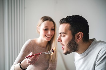 Couple sharing pancakes