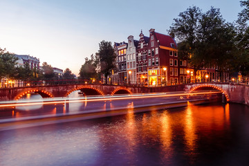 Evening building on the streets and amsterdam channels with illumination