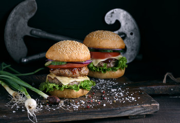 double burger with vegetables and cheese