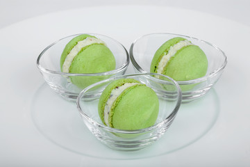 Light, gentle, airy French macaroons in individual glass cups.