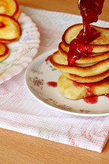 pancakes on a white plate with jam