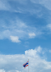A flag is in the sky and clouds and beautiful