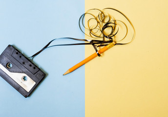 audio cassette and pencil