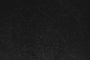 Old dark brown wooden background with scratches. Table texture.
