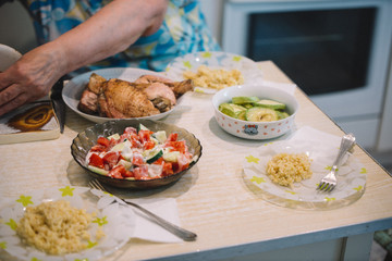 Homemade authentic russian ukrainian summer lunch at country side with salad, fryed chicken and porrige; lifestyle