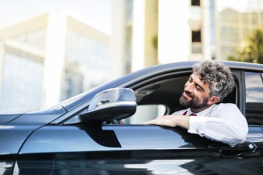 Businessman traveling by car