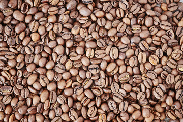 Freshly roasted coffee beans background.