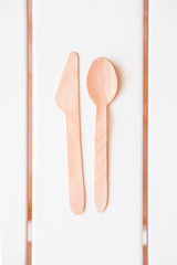 Disposable eco-friendly wooden utensil set  on white background. Go green, save environment concept