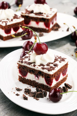 Chocolate cake with cherries and whipped cream. Black Forest cake