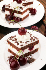 Chocolate cake with cherries and whipped cream. Black Forest cake