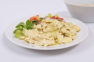 Baked zucchini vegetable salad on a white