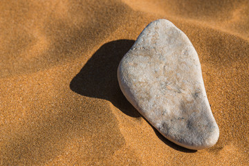 Stone in the sand of a beach