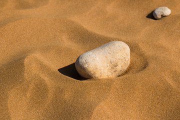 Stone in the sand of a beach