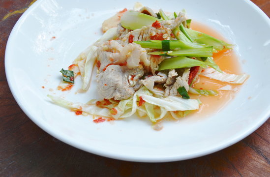 boiled pork slice dressing with lime garlic and chili sauce salad on plate