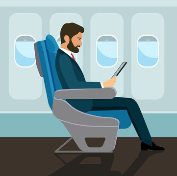 Passenger man  sitting in chair and  using tablet in airplane. Vector flat style illustration