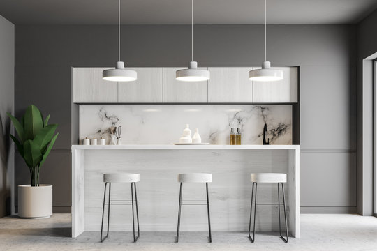 White bar in a gray kitchen interior