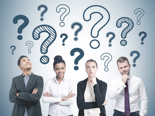 Diverse business team members, question marks