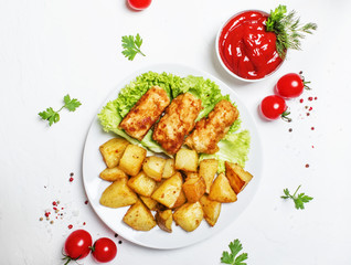 Fish and chips with tomato sauce ketchup, white background, top view