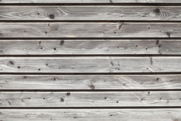 Graue Holzwand an einem Bauzaun, Holztextur
