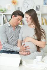 happy pregnant woman with husband